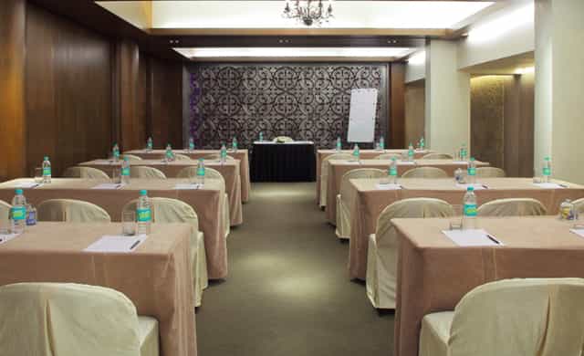 Crimson meeting room at The Mirador Hotel Mumbai, set for corporate events and workshops.