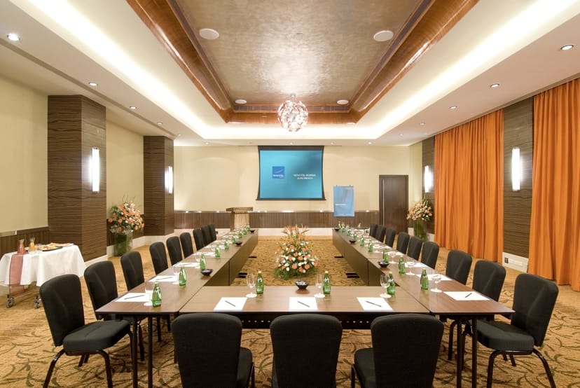 Meeting room at Novotel Mumbai Juhu Beach, elegant setup for professional events and conferences.