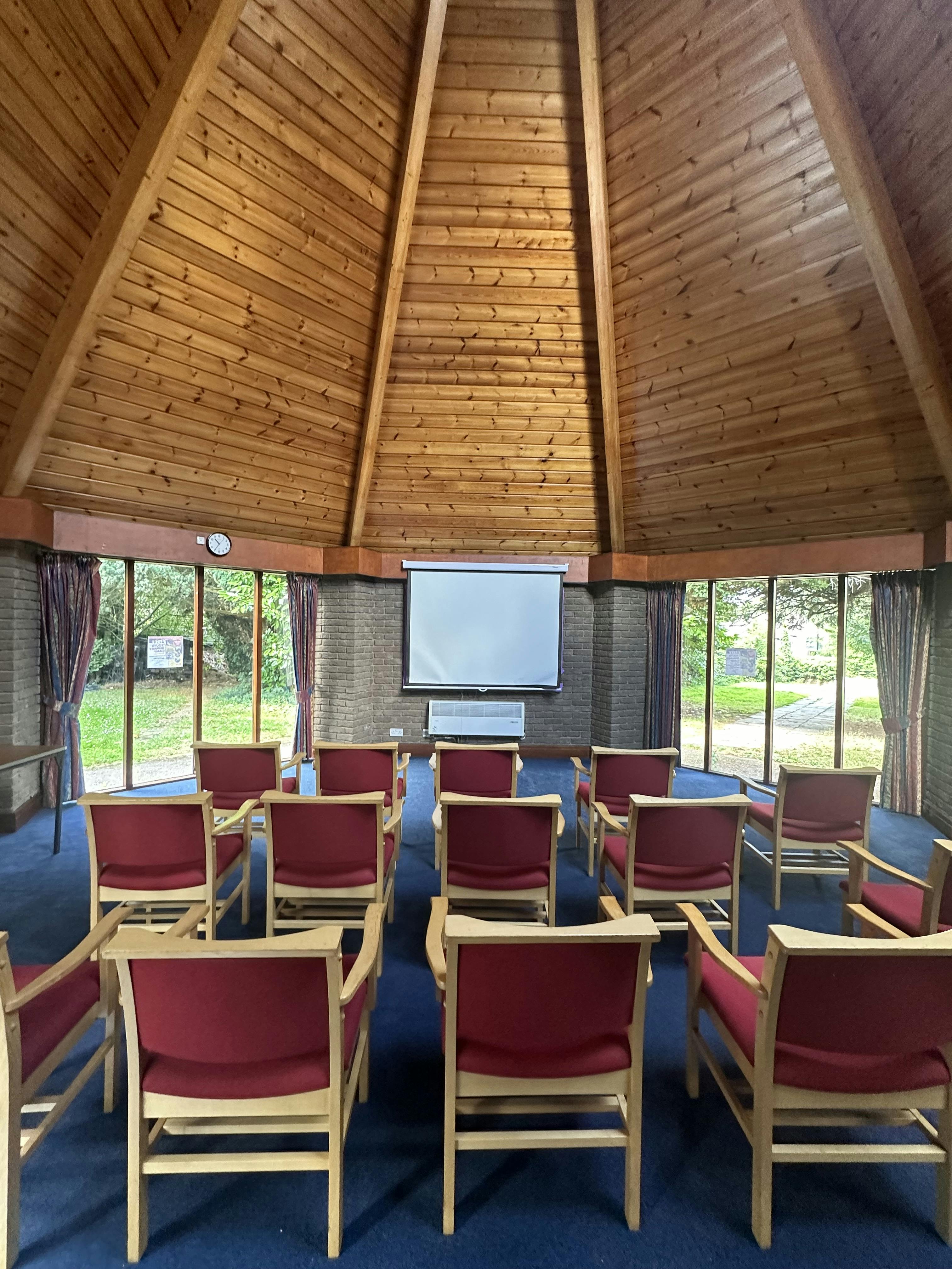 Well-lit meeting space with circular wooden ceiling for workshops and conferences in Coventry.