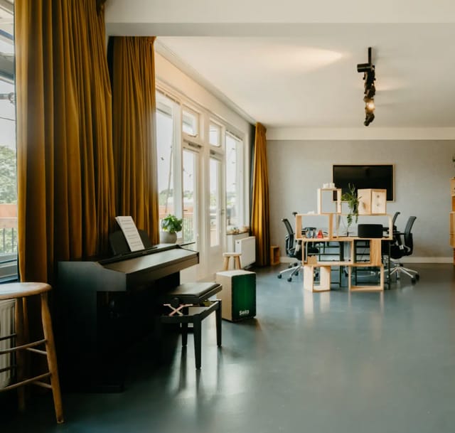 Penthouse meeting space with natural light, ideal for workshops and team-building events.