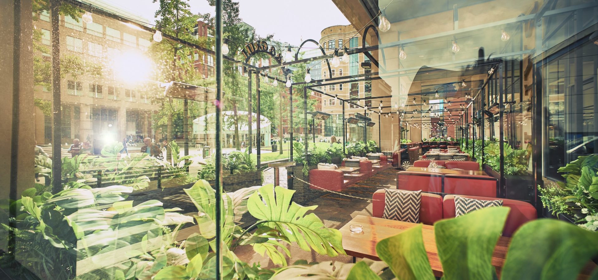 Vibrant outdoor event space at Bank Restaurant Bar & Grill with lush greenery. - Banner