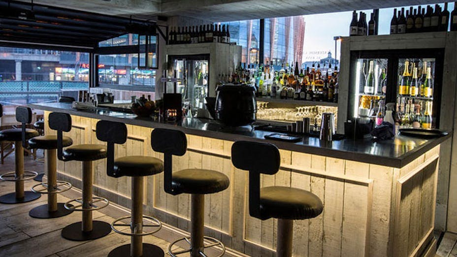 Modern bar setup at Bank Restaurant Bar & Grill, ideal for networking events and gatherings.