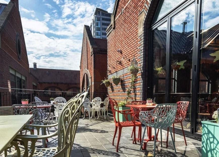 Charming outdoor terrace at Cosy Club Brindleyplace for casual meetings and networking.