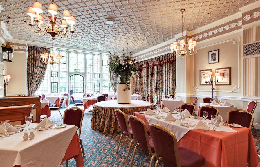 Elegant banquet room at Plough & Harrow Hotel, perfect for weddings and corporate events. - Banner