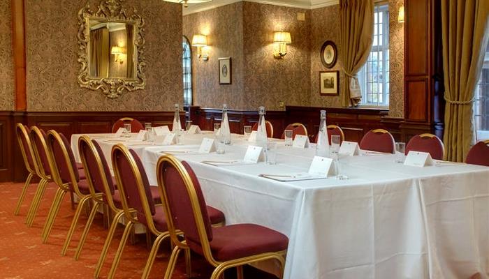 Elegant meeting room at Plough & Harrow Hotel, perfect for corporate events and workshops.
