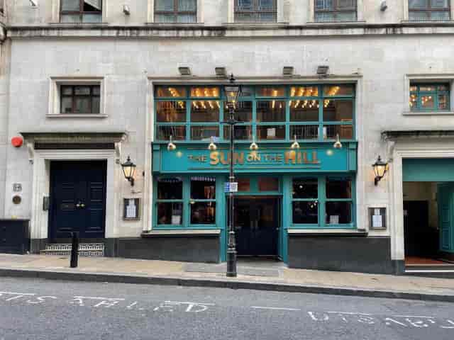 Charming venue "The Sun on the Hill" with large windows for social events and meetings.