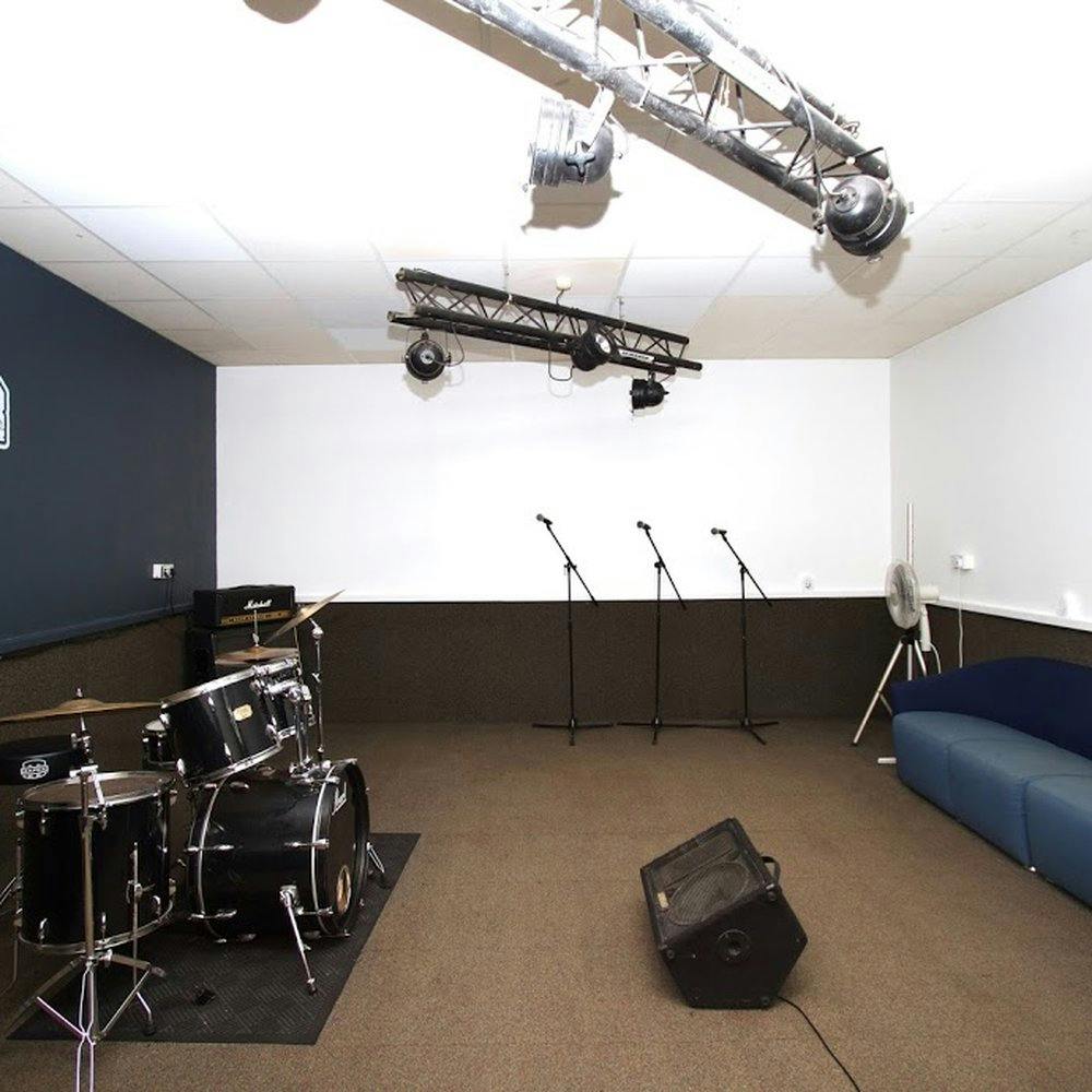 Rehearsal Studio in The Mushrooms with stage, ideal for live performances and workshops.