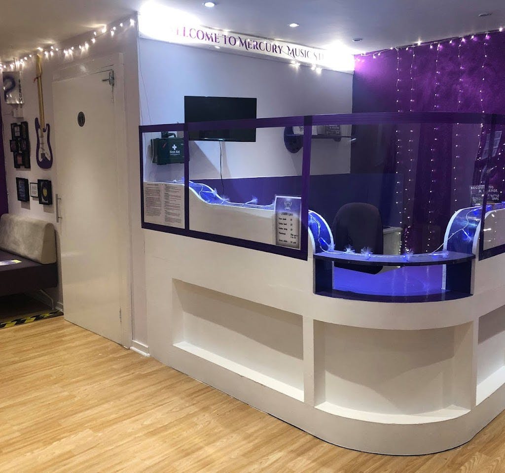 Modern reception area with purple accents for meetings and events at CapsaArx Studios.