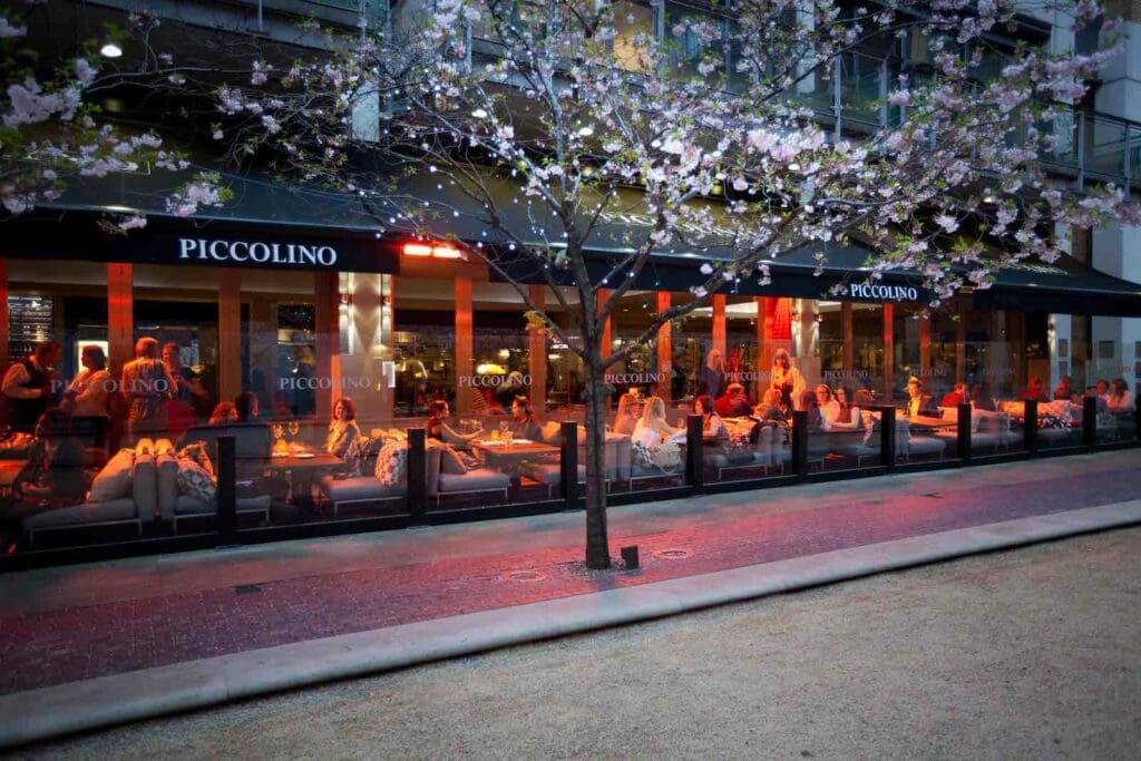Alfresco Terrace at Piccolino Birmingham, vibrant outdoor dining with cherry blossom tree. - Banner