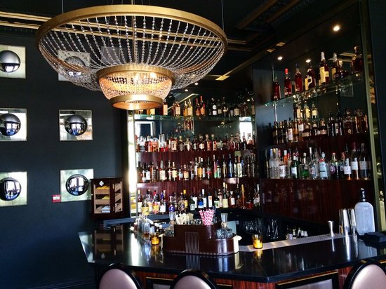 Stylish cocktail lounge in Edgbaston with elegant chandelier, perfect for receptions. - Banner