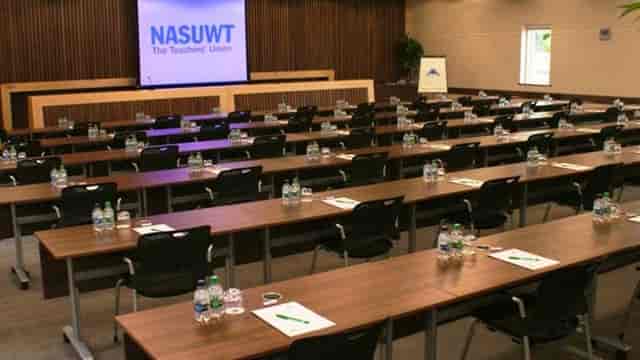 Conference room setup at Hillscourt Hotel with NASUWT logo for professional events.
