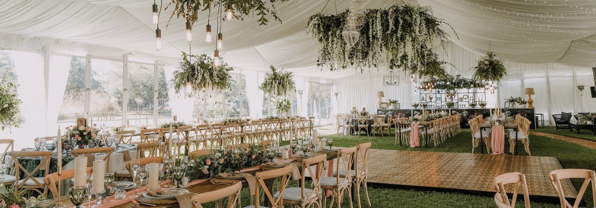 Elegant wedding venue at Marquee Croft, Eyam Hall with lush greenery and soft lighting.