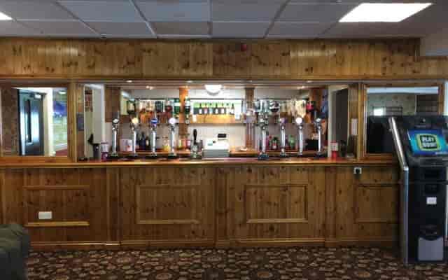 Function Room bar at Avenue Club, featuring wooden paneling for networking events.