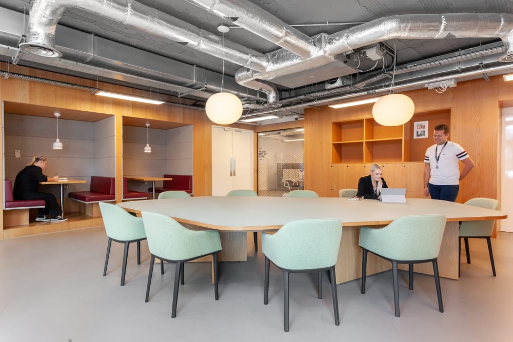 Modern meeting space with oval table for collaboration at Virtual Office Solutions. - Banner