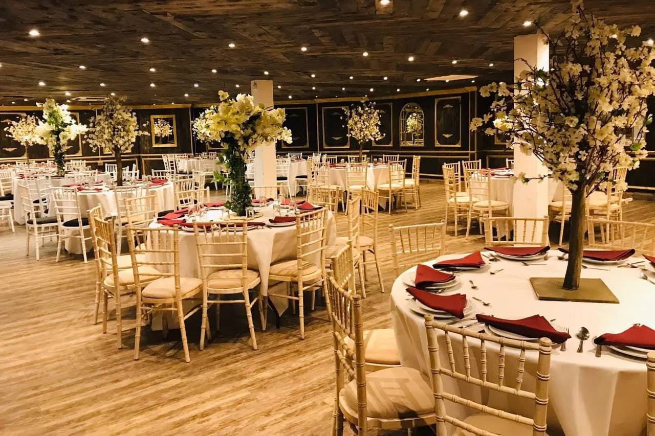 Elegant event space at Excalibur Grand with round tables, ideal for formal dinners and networking.