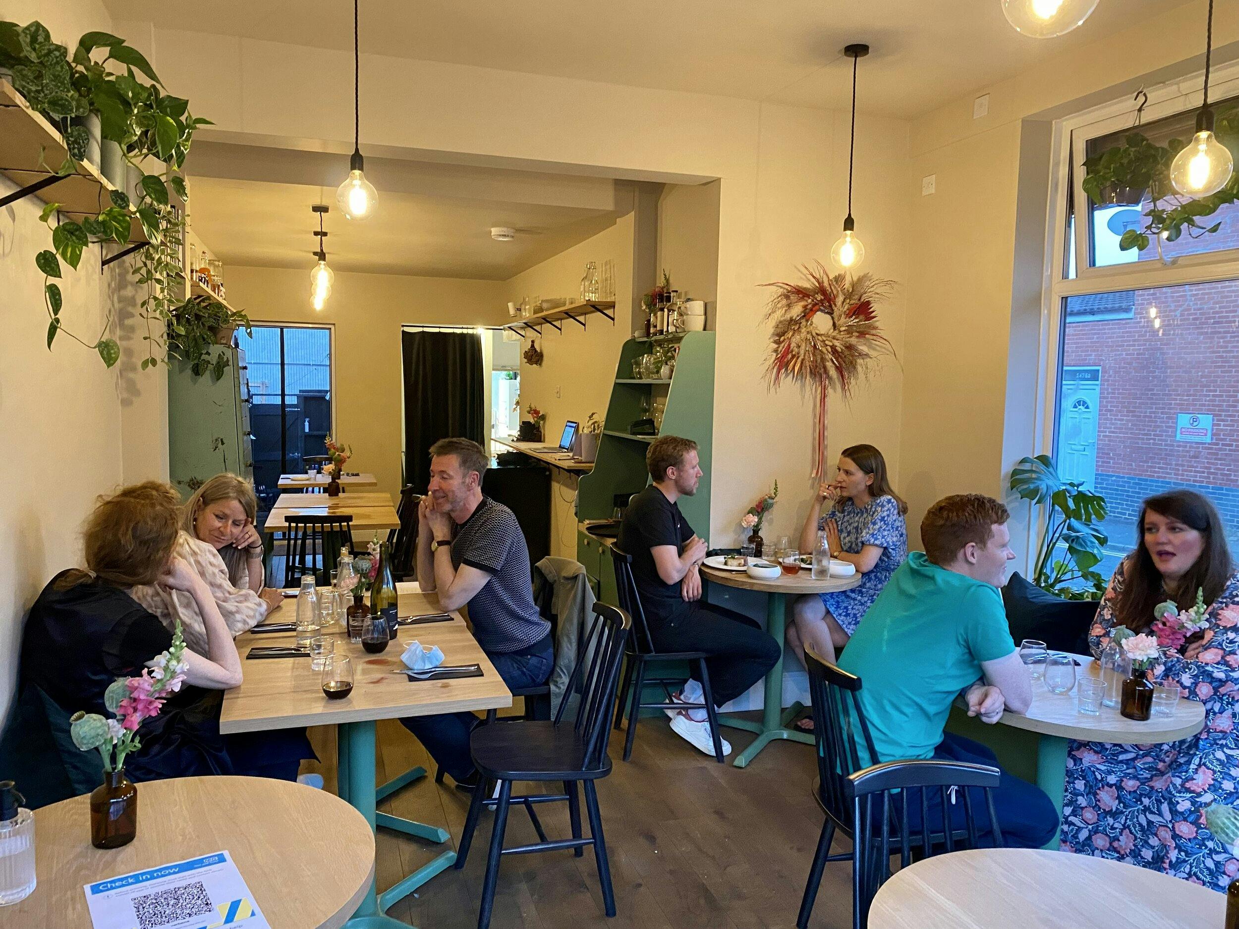 Cozy dining space in Verbena, perfect for networking events and small gatherings.