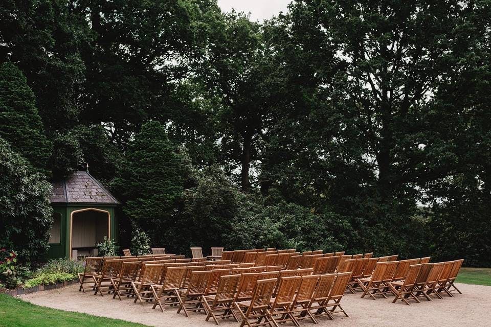 Yurt in Thorpe Garden set up for outdoor workshops with wooden chairs and serene backdrop.