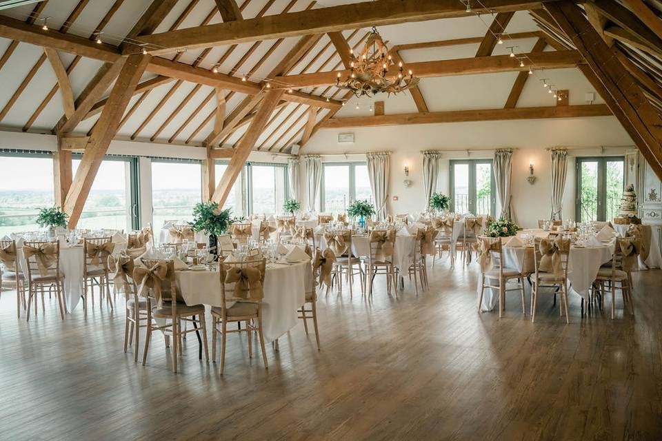 Elegant round tables in Deer Park Hall, ideal for weddings and corporate events.