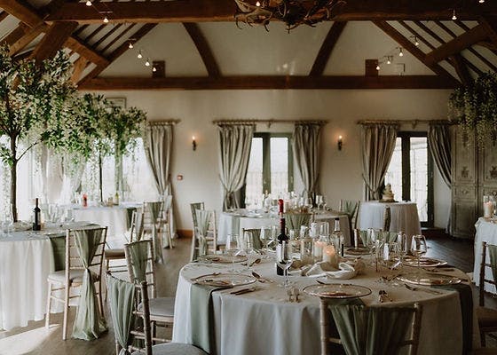 Elegant event space in Deer Park Hall with lush greenery, perfect for weddings.