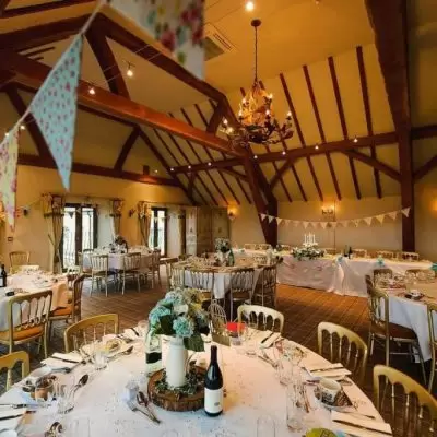 Panelled Hall in Deer Park: elegant wedding venue with warm beams and floral decor. - Banner
