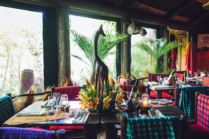 "Akamba Bar & Eatery dining space with vibrant decor for intimate events and gatherings." - Banner