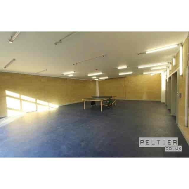 Spacious Kentish Town Community Centre room with ping pong table for events and gatherings.