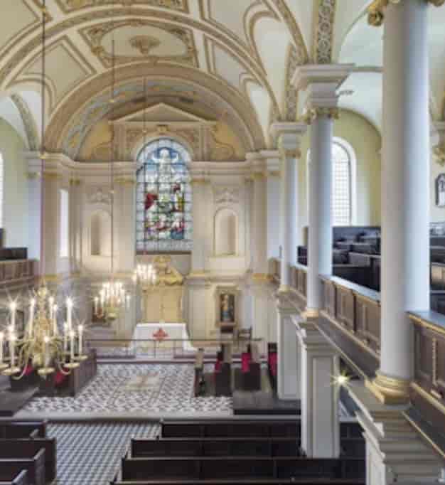 St Giles in the Fields Church event space with elegant architecture and stained glass windows.