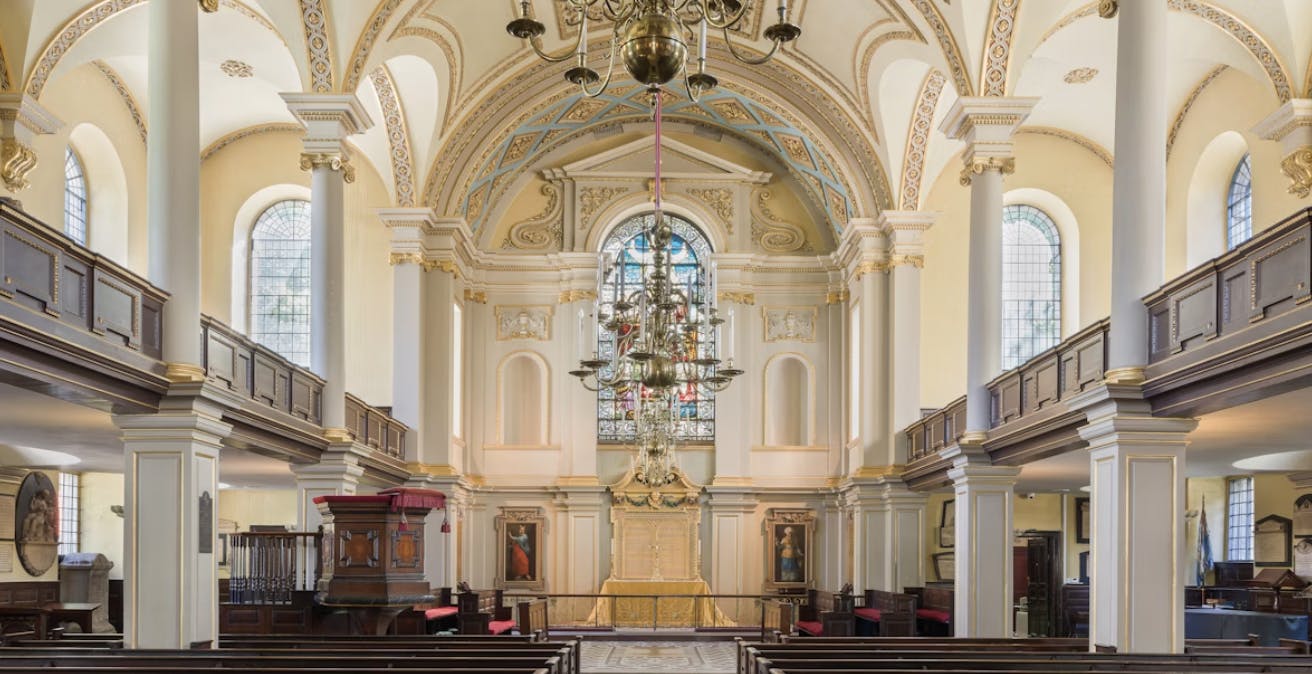 St Giles in the Fields Church interior with stained glass, ideal for ceremonies and events.