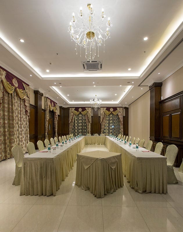 Grand Ballroom at The Grand Magrath Hotel, elegant decor for corporate meetings.