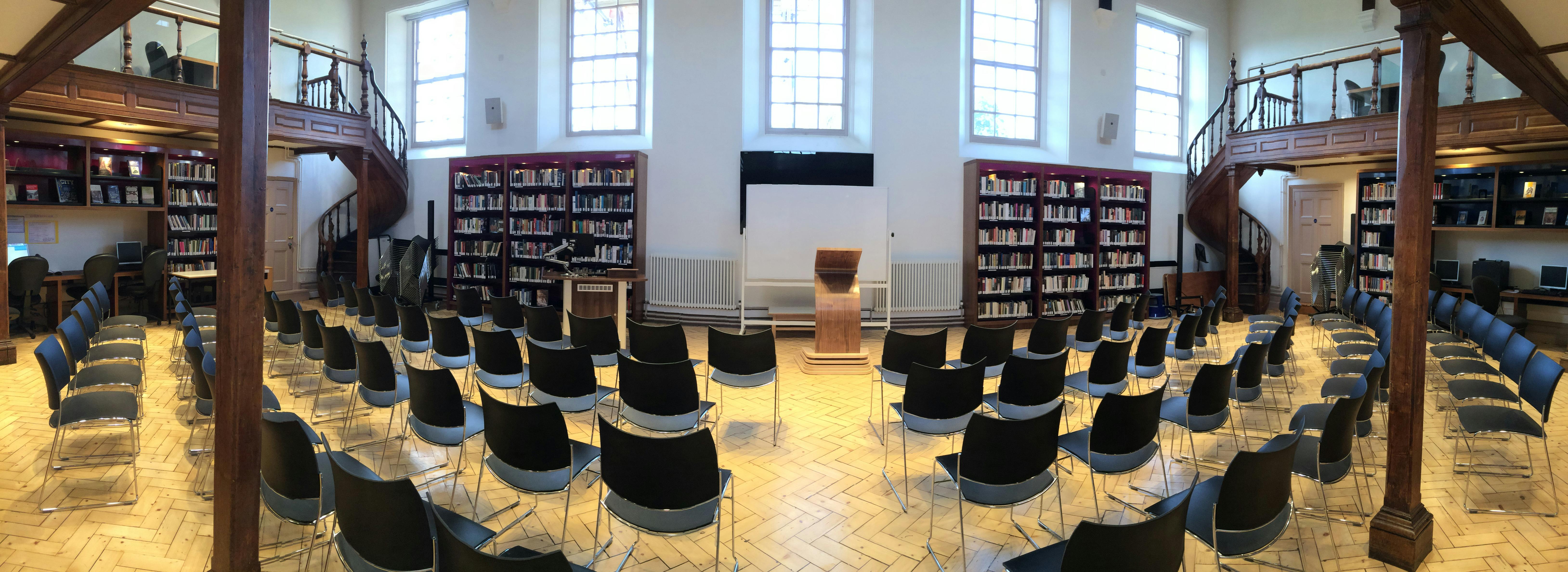 Garnett Room at Marlborough College: organized event space with black chairs for presentations.