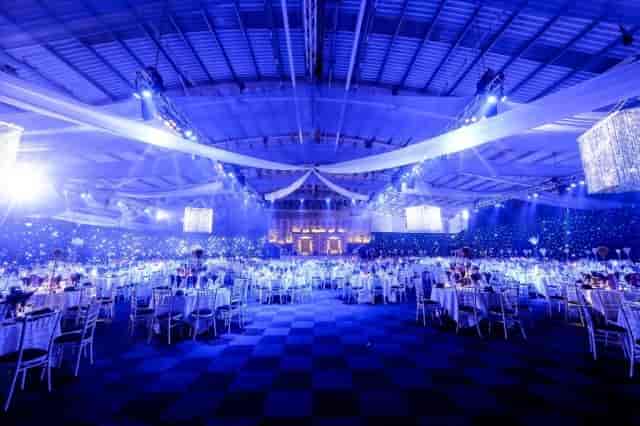 Moonlight & Mistletoe Christmas Party at The ICC Birmingham, elegant tables and blue lighting.