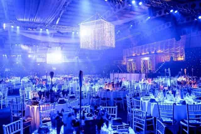 Elegant gala setup with blue lighting at Moonlight & Mistletoe Christmas Party, Birmingham.