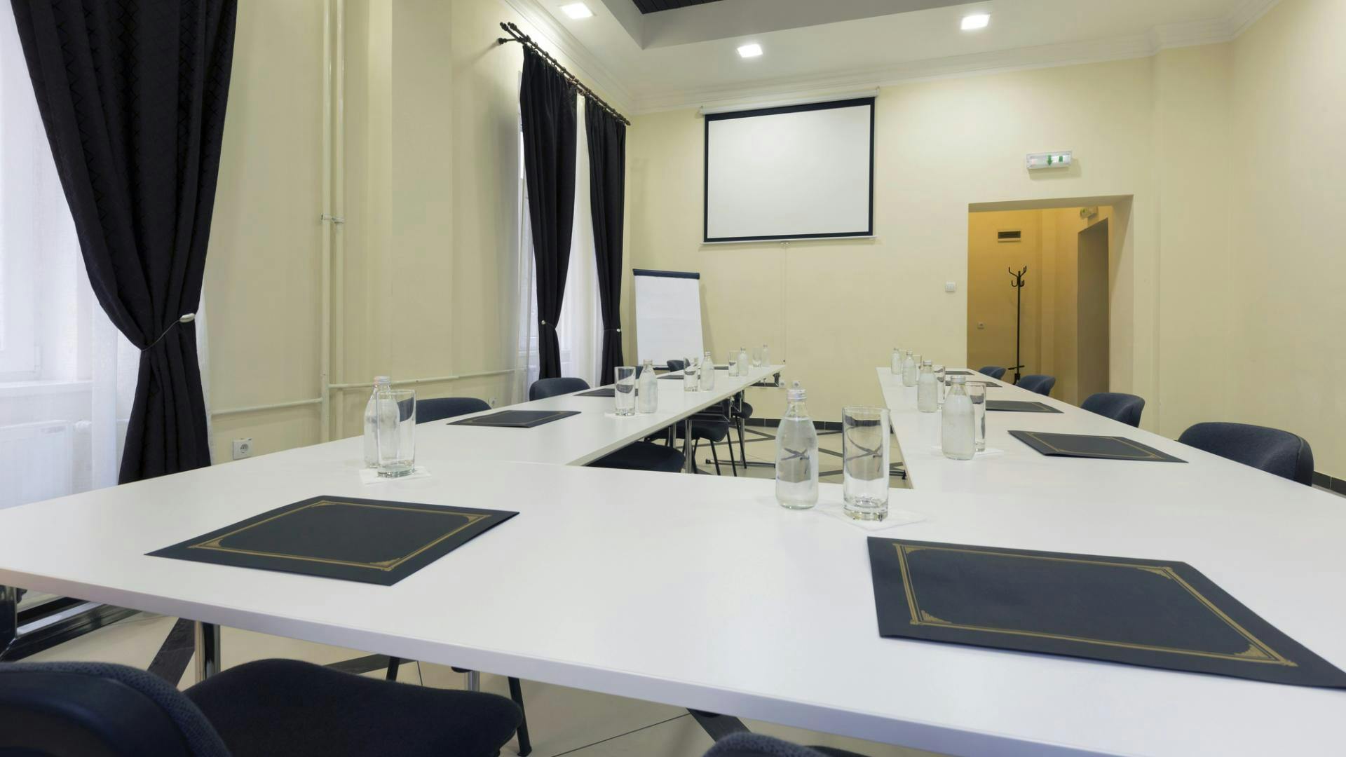 Boardroom in Jewellery Quarter Conference Centre with long table, ideal for meetings and presentations.
