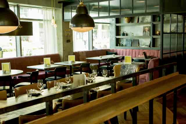 Semi-private dining area in Brasserie Blanc, perfect for intimate meetings and events.