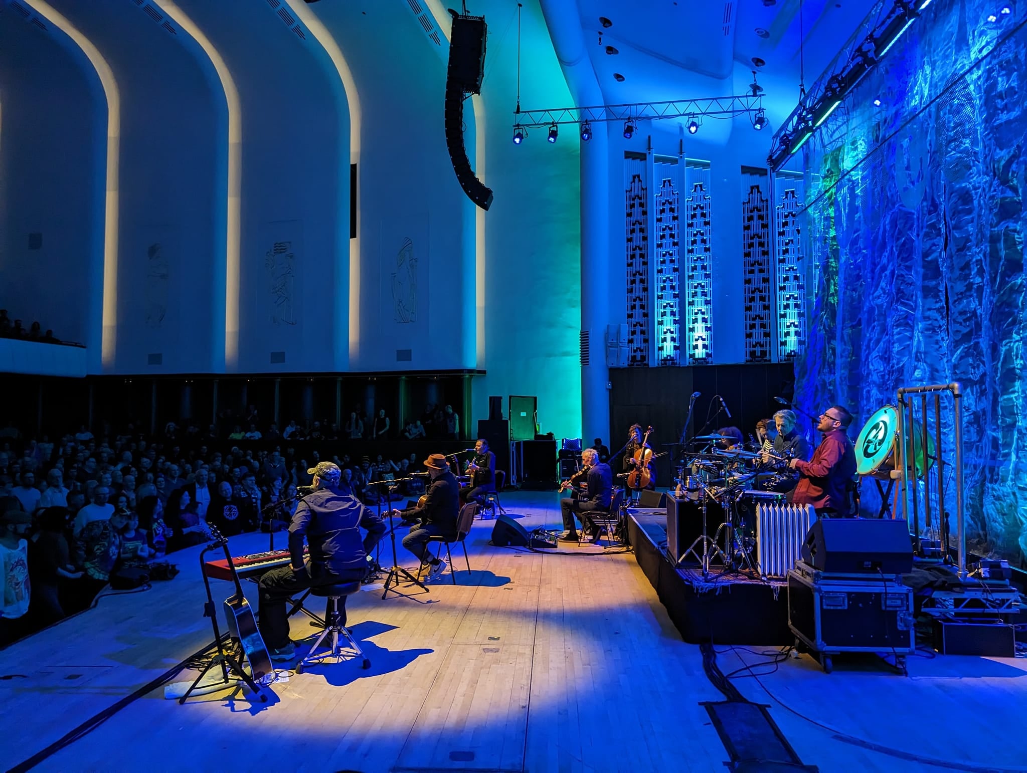 Vibrant live performance in spacious Stage Studios with dramatic lighting and engaged audience. - Banner