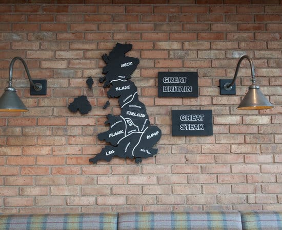 Restaurant wall display with Great Britain map, ideal for themed dining events.