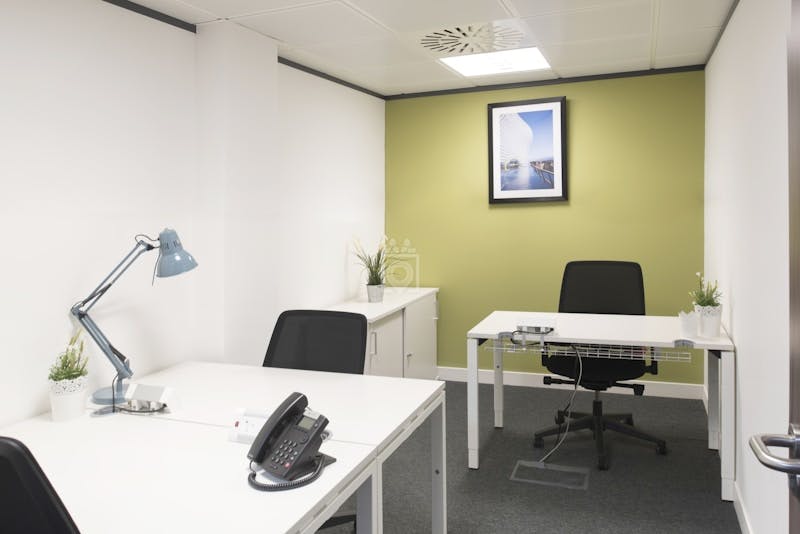 Modern minimalist office space in Edmund House, ideal for meetings and brainstorming sessions.