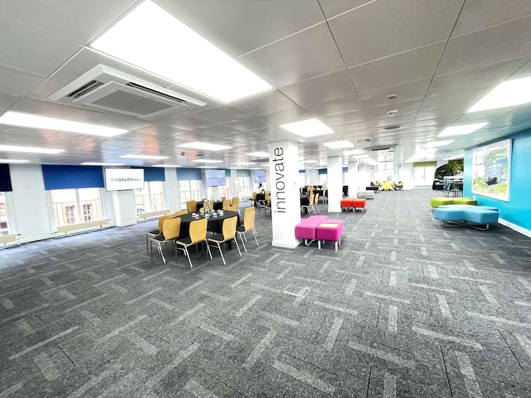 Versatile event space with flexible seating for workshops and networking events.