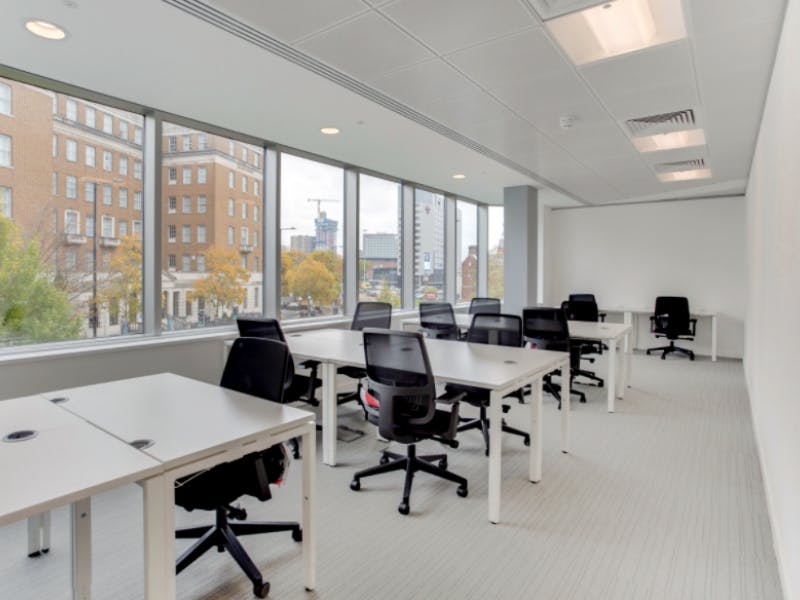 Modern meeting room in Apex House with large windows for natural light, ideal for workshops.