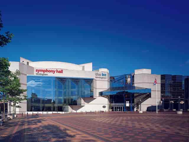 Modern ICC venue in Birmingham with glass facade, ideal for conferences and performances.
