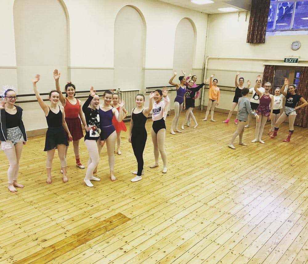 Vibrant dance studio with young dancers rehearsing in Rutleigh Norris School of Dance.