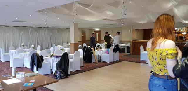 Elegant conference room with draped ceilings, ideal for weddings and corporate events.