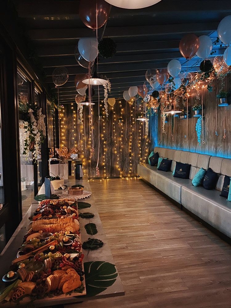 Elegant function room at Brick & Beam with cozy seating for intimate events. - Banner