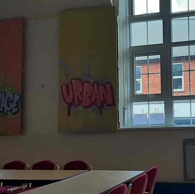 Tina Philips Training Room mural, vibrant urban art for creative events and meetings.