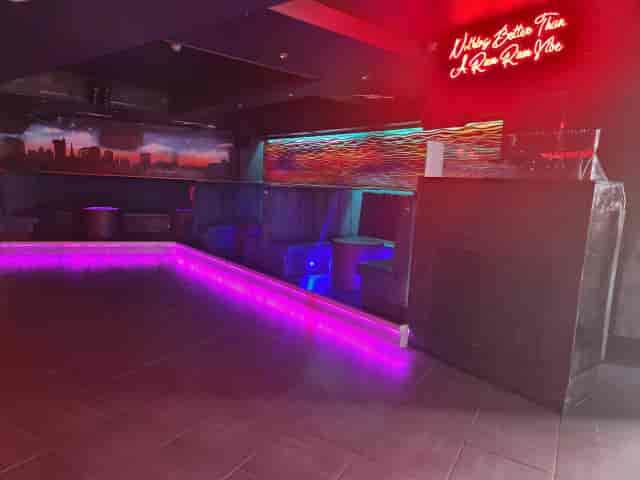 Modern Rum Rum Bar nightclub with vibrant lighting, ideal for networking events and parties.