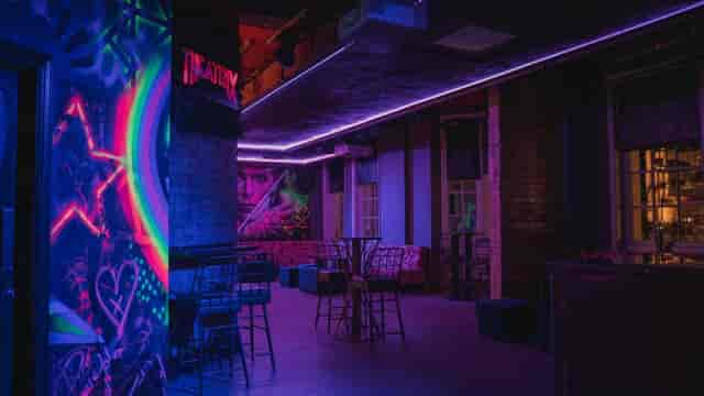 Vibrant event space with neon lighting in Theatrix Birmingham for creative gatherings.