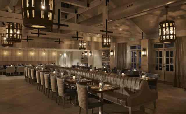 Elegant Blythe Room with inviting table setup, ideal for corporate events and upscale dinners.