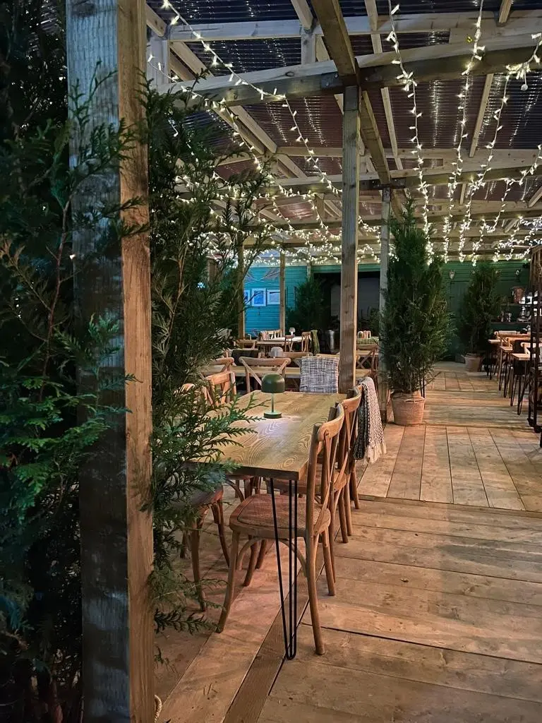 Rustic event space at The Botanist Gas Street Basin with greenery and warm lighting. - Banner