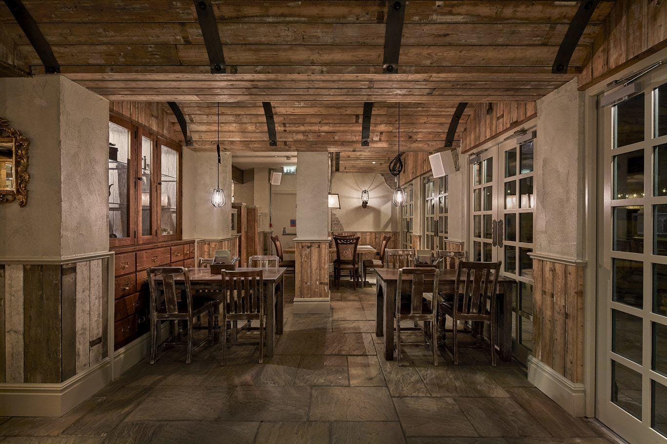Rustic bar with warm wood accents, ideal for intimate gatherings and networking events.