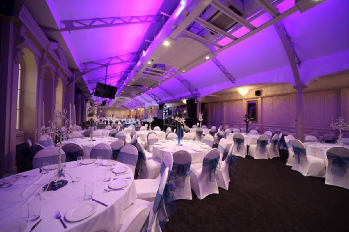 Elegant event space at Grand Station with white linens, perfect for weddings and corporate events.